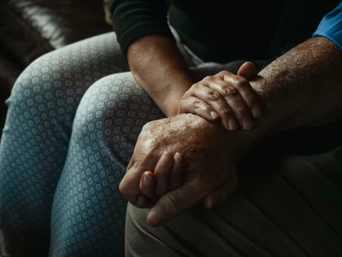 a closeup shot of people holding hands