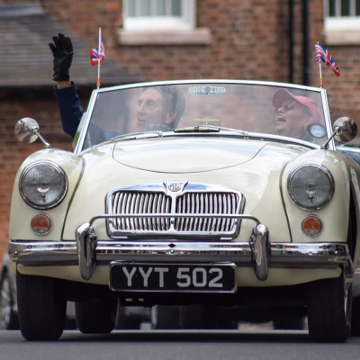 an mg mga car in the parade through audlem