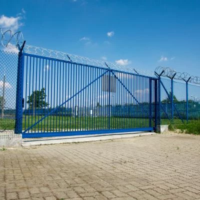 Industrial gates with barbed wire
