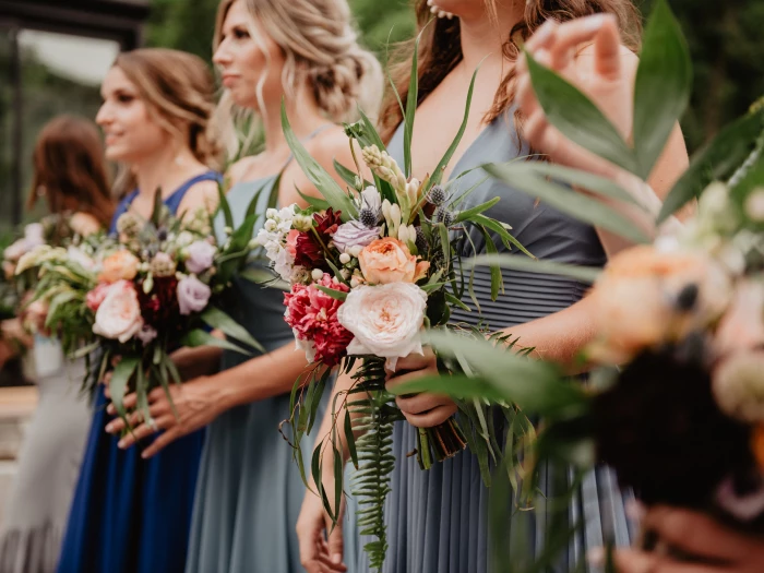 Selective Focus Photography of Women Holding Wedding Flowers