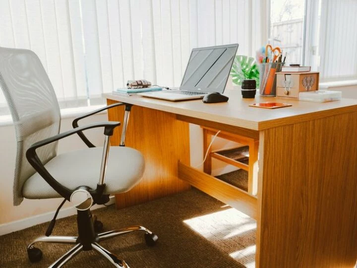 White Rolling Armchair Beside Table