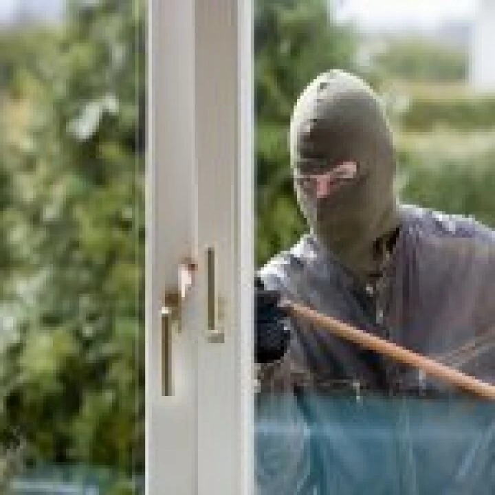 Burglar breaking in