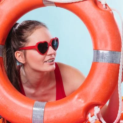 Woman in sunglasses with ring buoy lifebuoy.