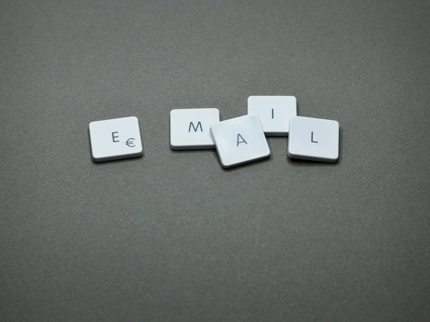 closeup of the word 39email39 formed with letter tiles on a gray surface