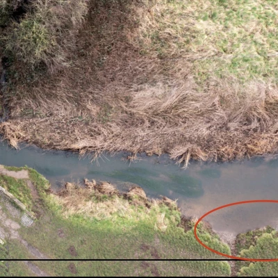 drone photo of erosion at the packhorse bridges with ellipse
