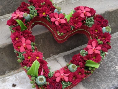 funeral flowers heart wreath red flowers