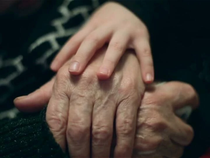 handofalittlegirlfondlingoldhandsofgrandmotherwithlovechildiscaringforgrandmothersaxjfuanf0000