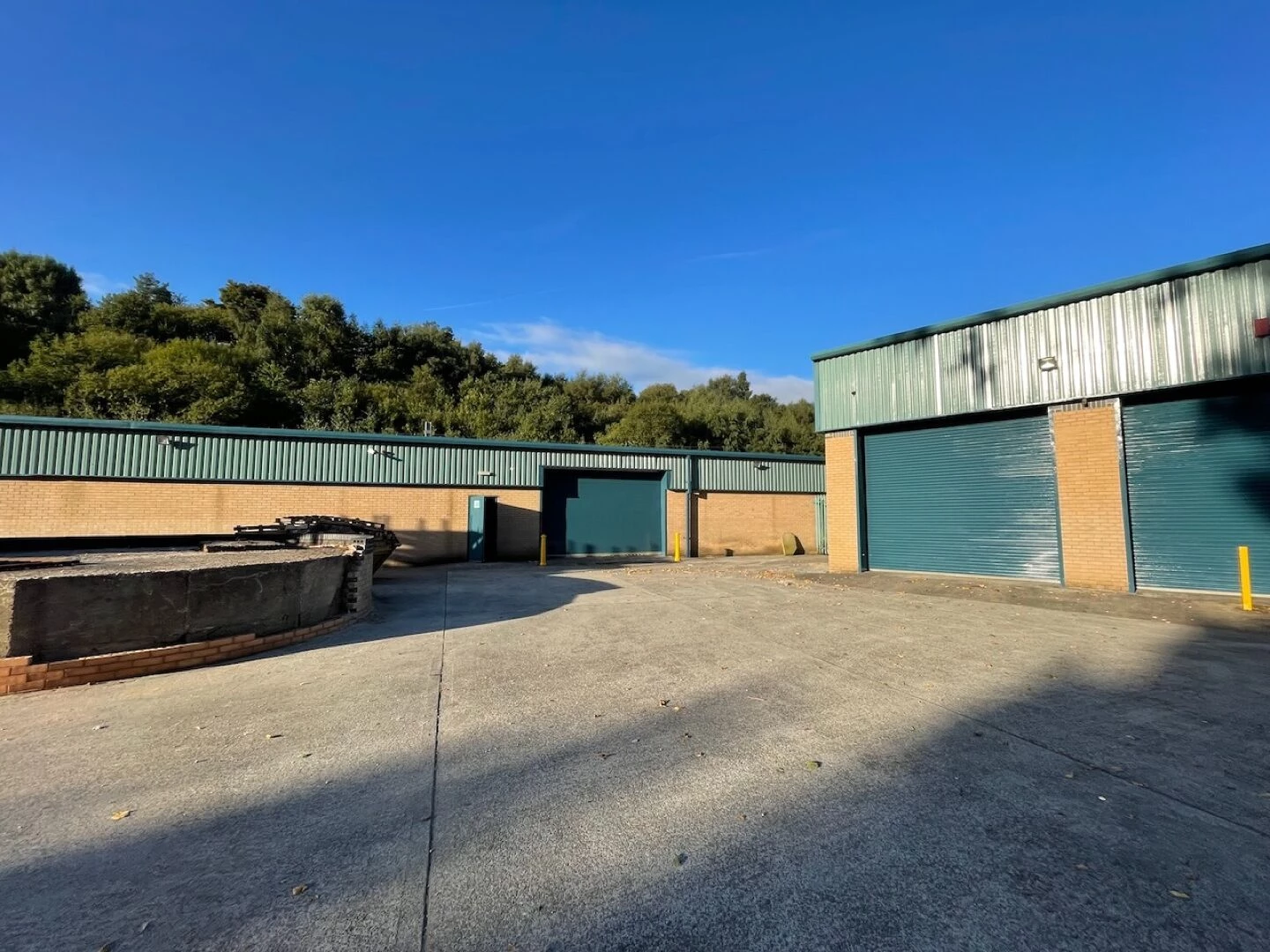 industrial units with green roofs and brick walls