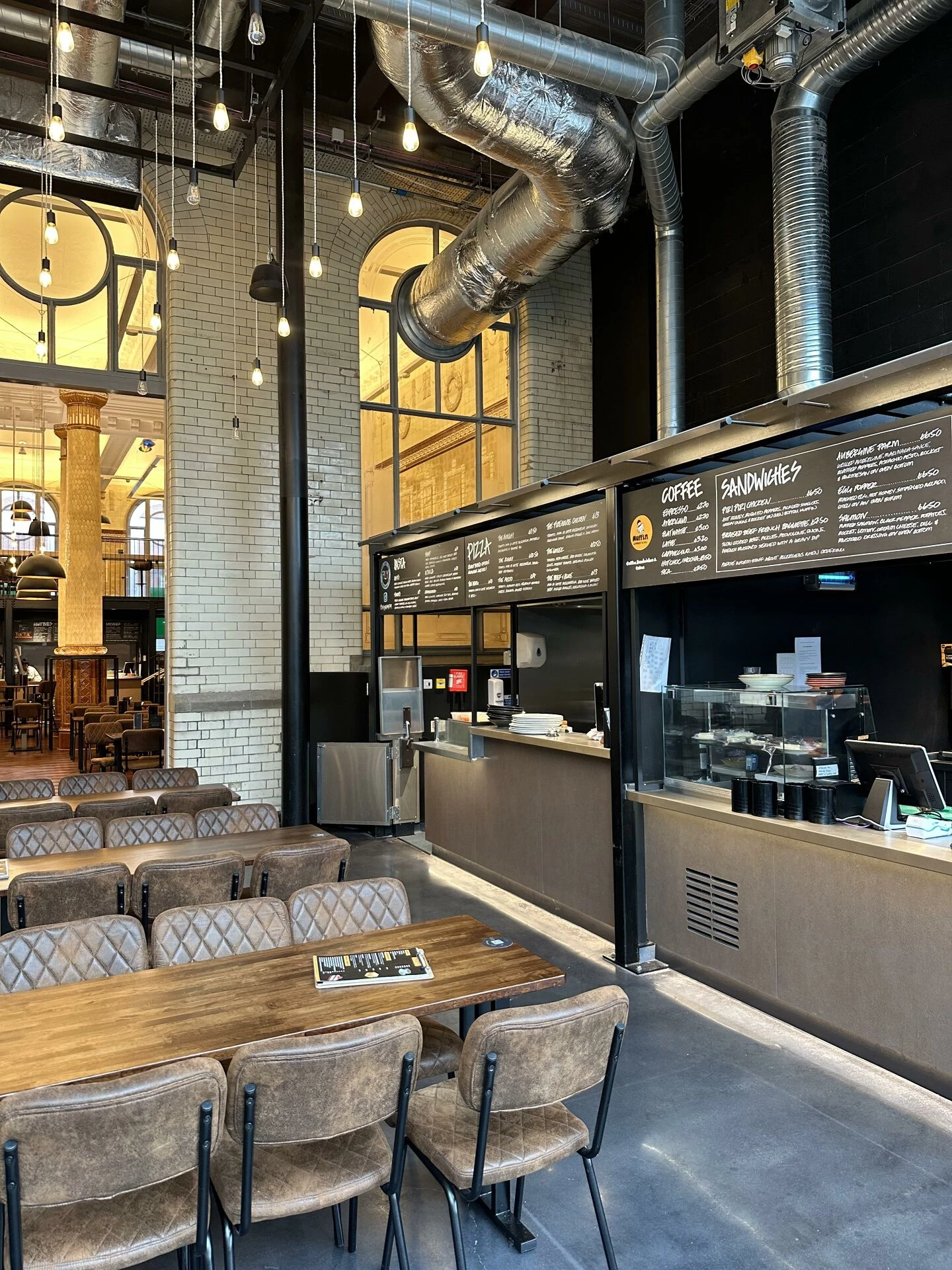 large modern openplan restaurant with indistrial themed fitout