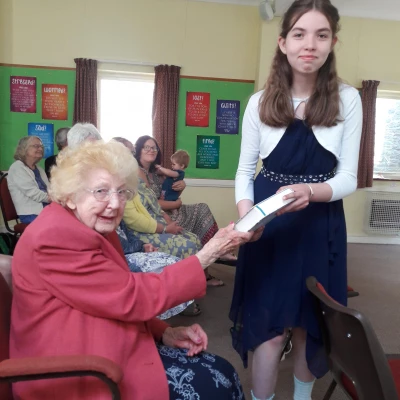 leah receives a bible from kinnerton chapel steward