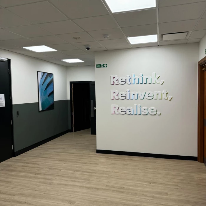 n office wall decorated with inspiring slogans