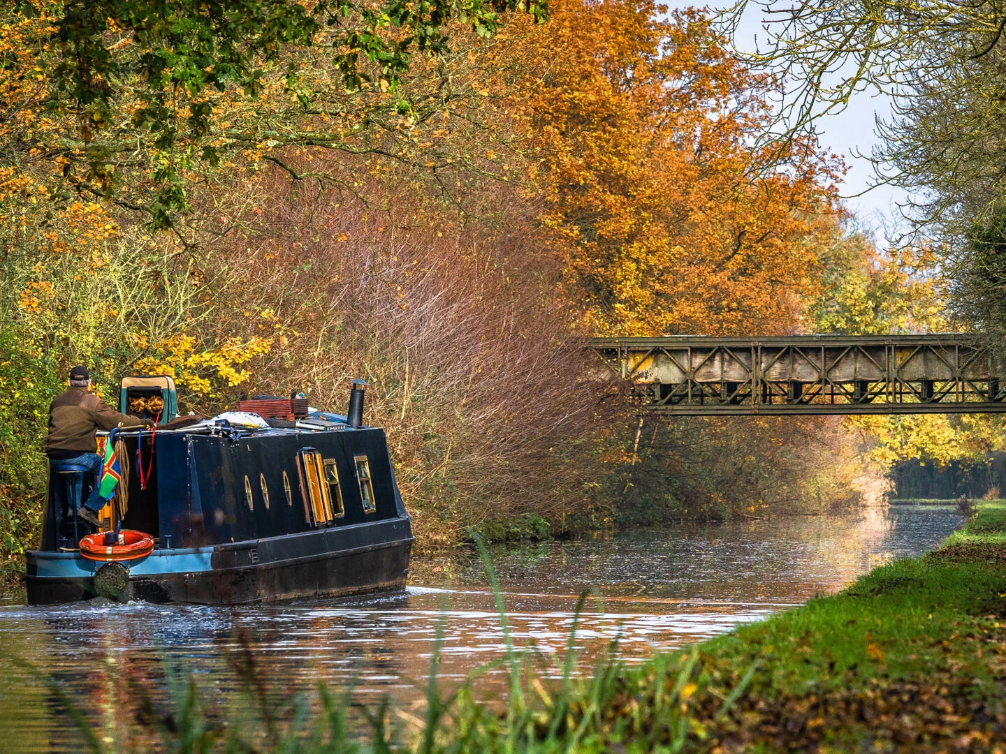 narrowboat on a canal in autumn