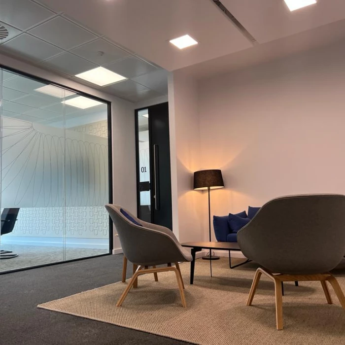 office meeting area in leeds with chairs and lamps