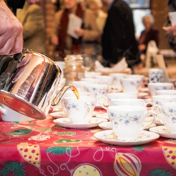 pouring a cup of tea after the service