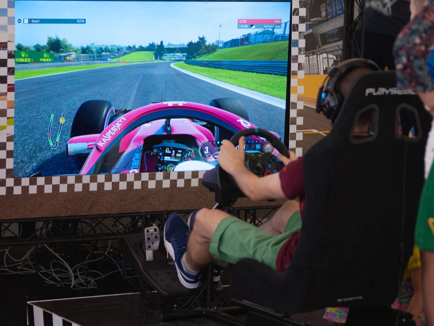 racing sim rig with a large screen