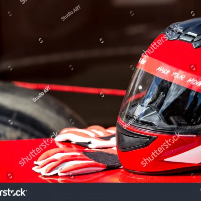 stock photo red helmet with gloves for riding on a racing car 283266113