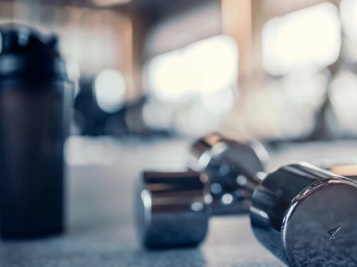 weights on the floor of a gym